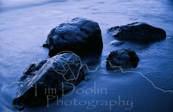 Rocks along Yellowstone Lake at dusk.jpg