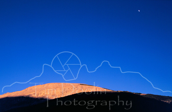 Red Rock and full moon above whiskey Mtn camp.jpg
